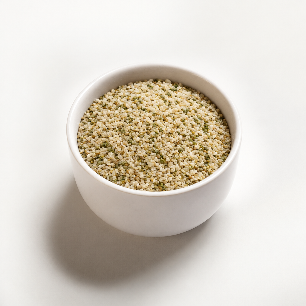 Organic hemp hearts in a white bowl, angled view