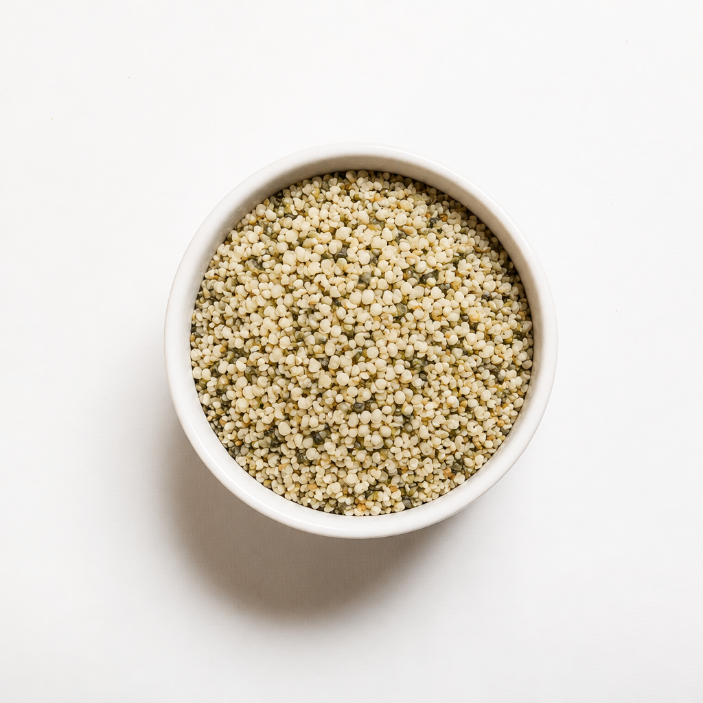Organic hemp hearts in a white bowl, overhead view