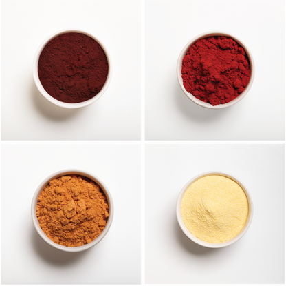 Four bowls with different colored powders on a white background
