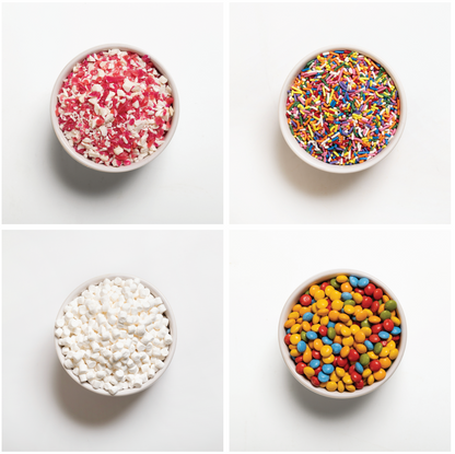 Four bowls with different types of colorful toppings on a white background