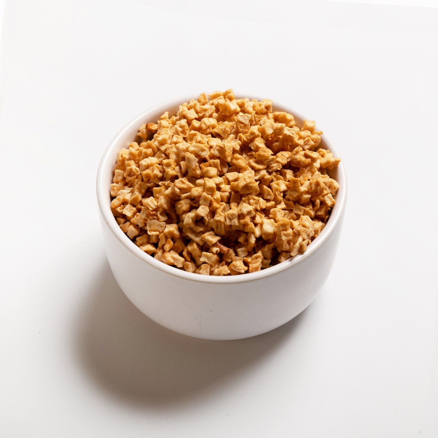 A bowl filled with Chewy Apple pieces from RHBULK 