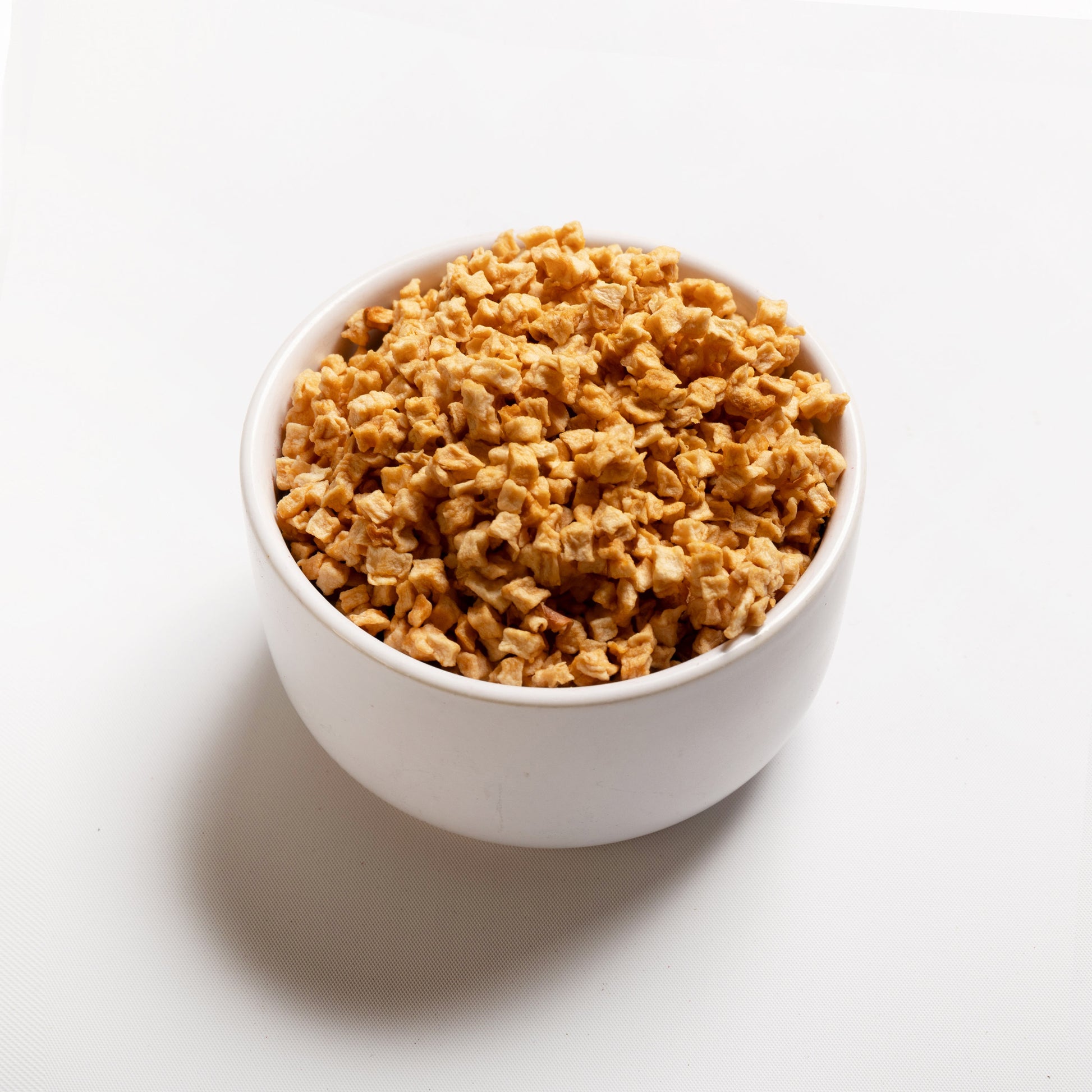 A bowl filled with Chewy Apple pieces from RHBULK 