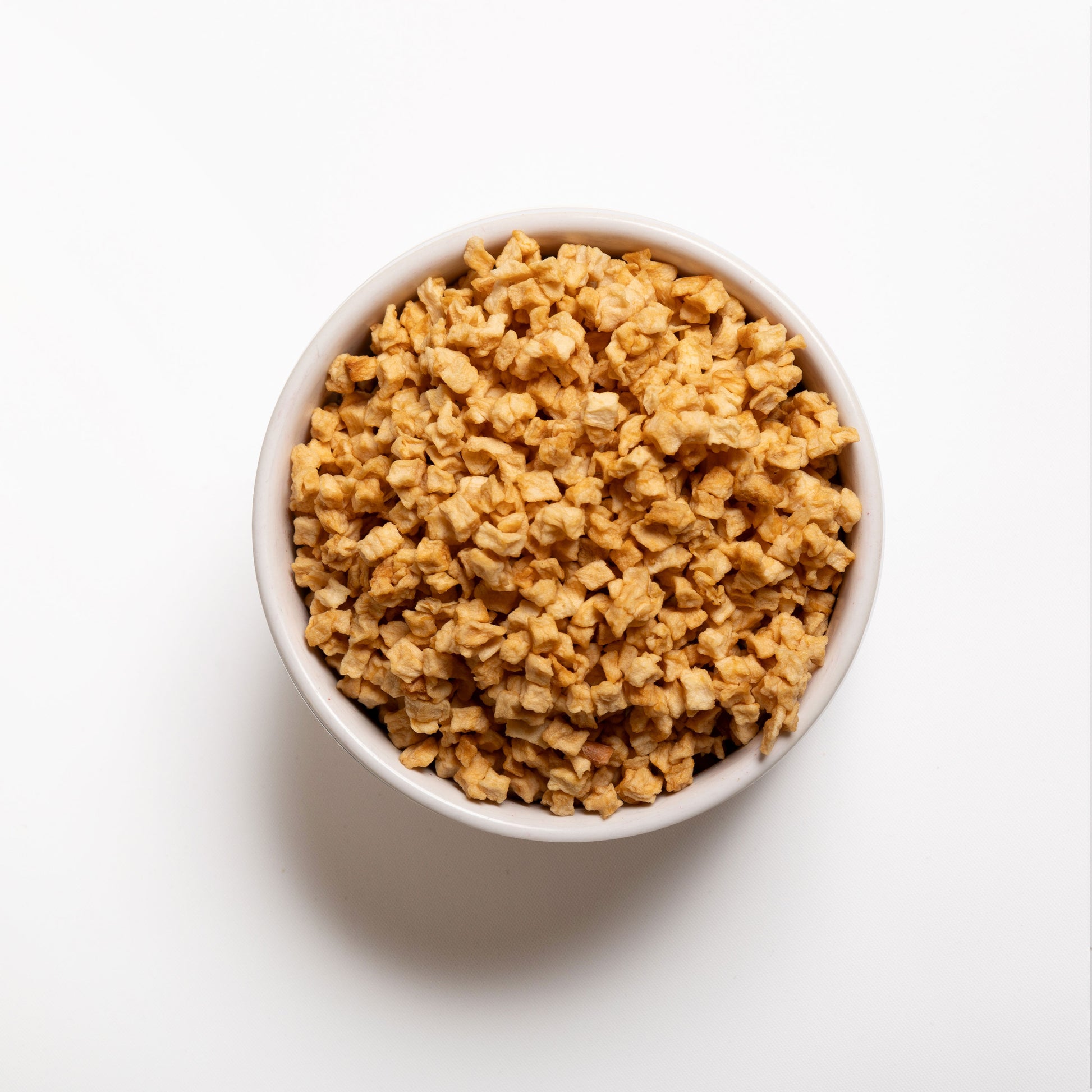 A white bowl filled with chewy apple pieces from RHBULK 
