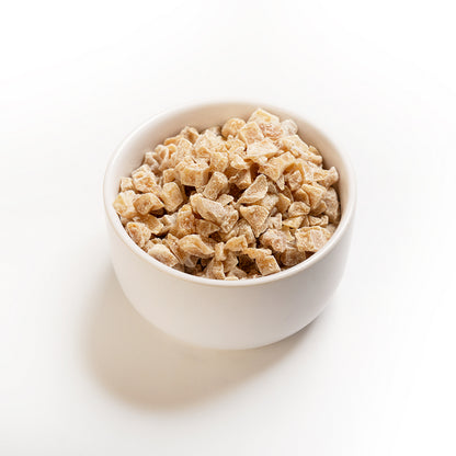 A bowl of RHBULK crystallized ginger pieces on a white background.
