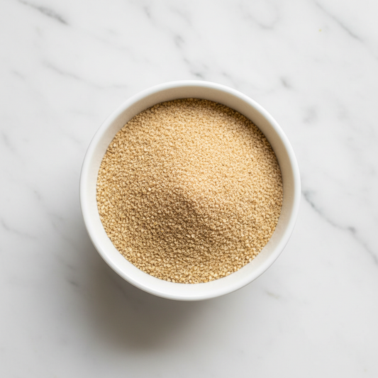 White bowl of Ground Golden Flaxseed from a top view 
