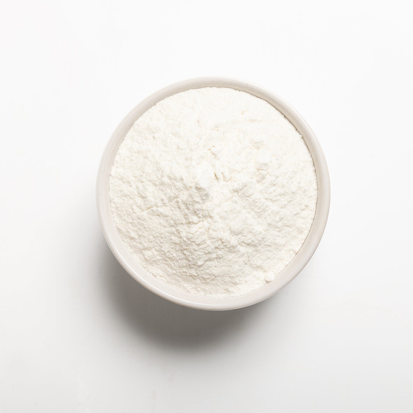 White Rice Flour in a bowl on a white background