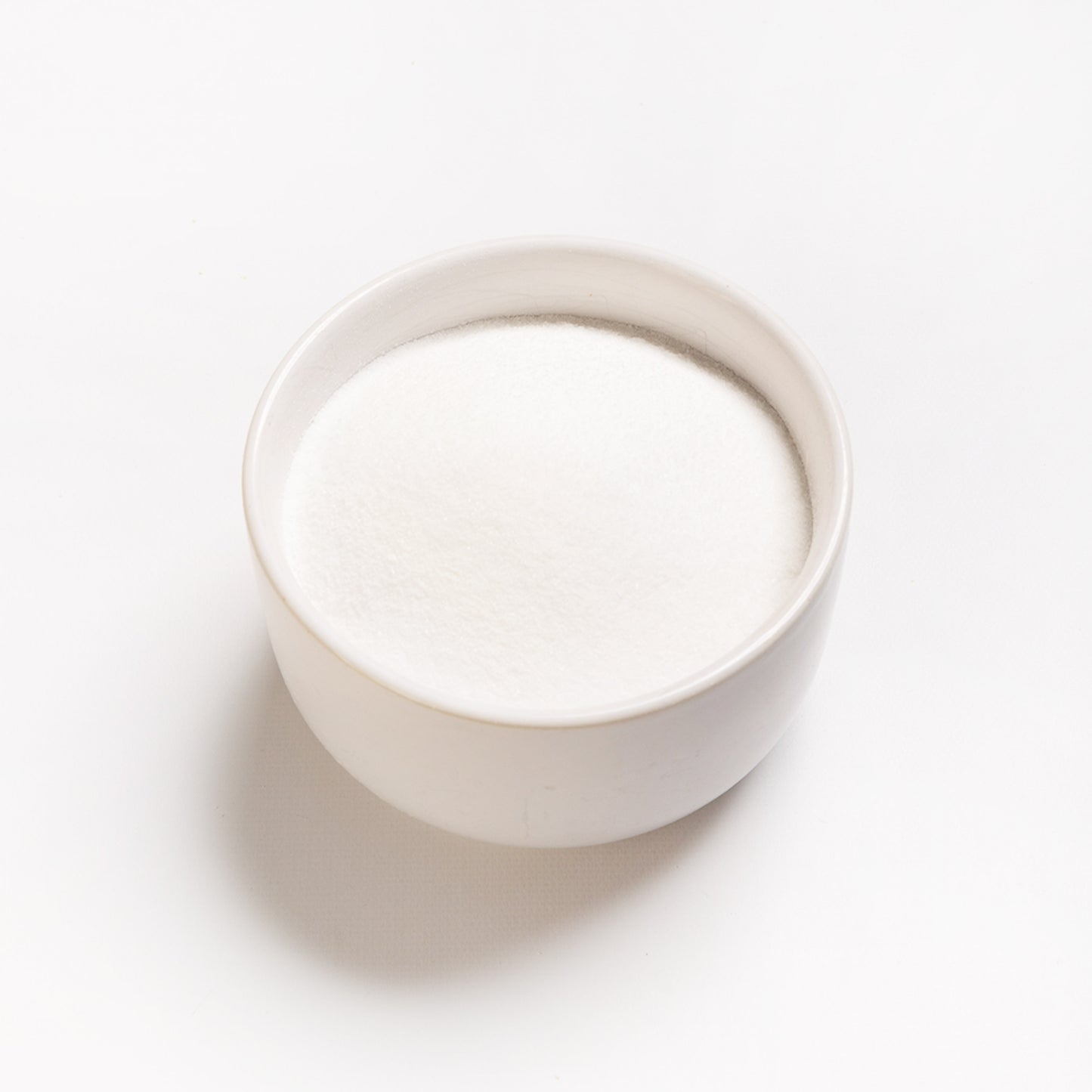 A bowl filled with malic acid powder 