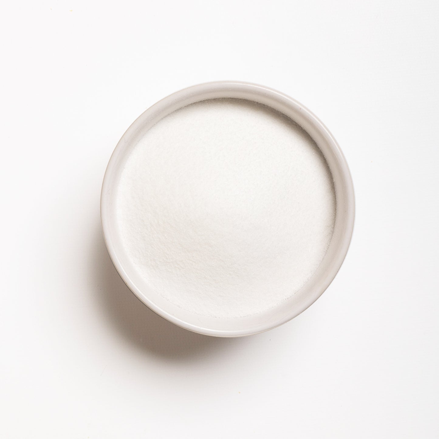 A bowl filled with Malic Acid powder 