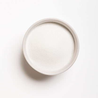 A bowl filled with Malic Acid powder 