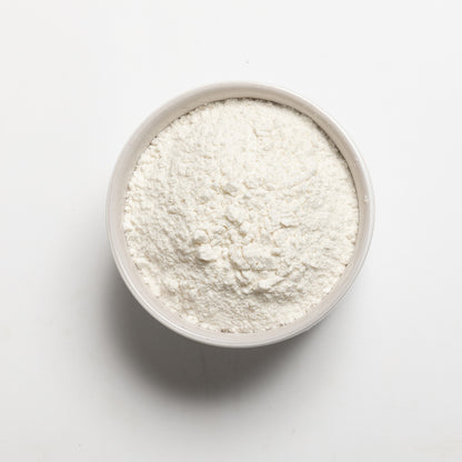 Medium Grain White Rice flour in a bowl on a light gray background