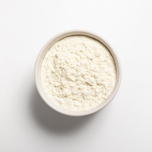 A white bowl filled with milk protein concentrate.