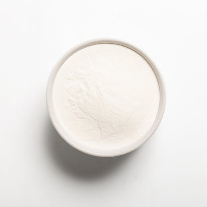 A bowl filled with modified tapioca starch on a light gray background