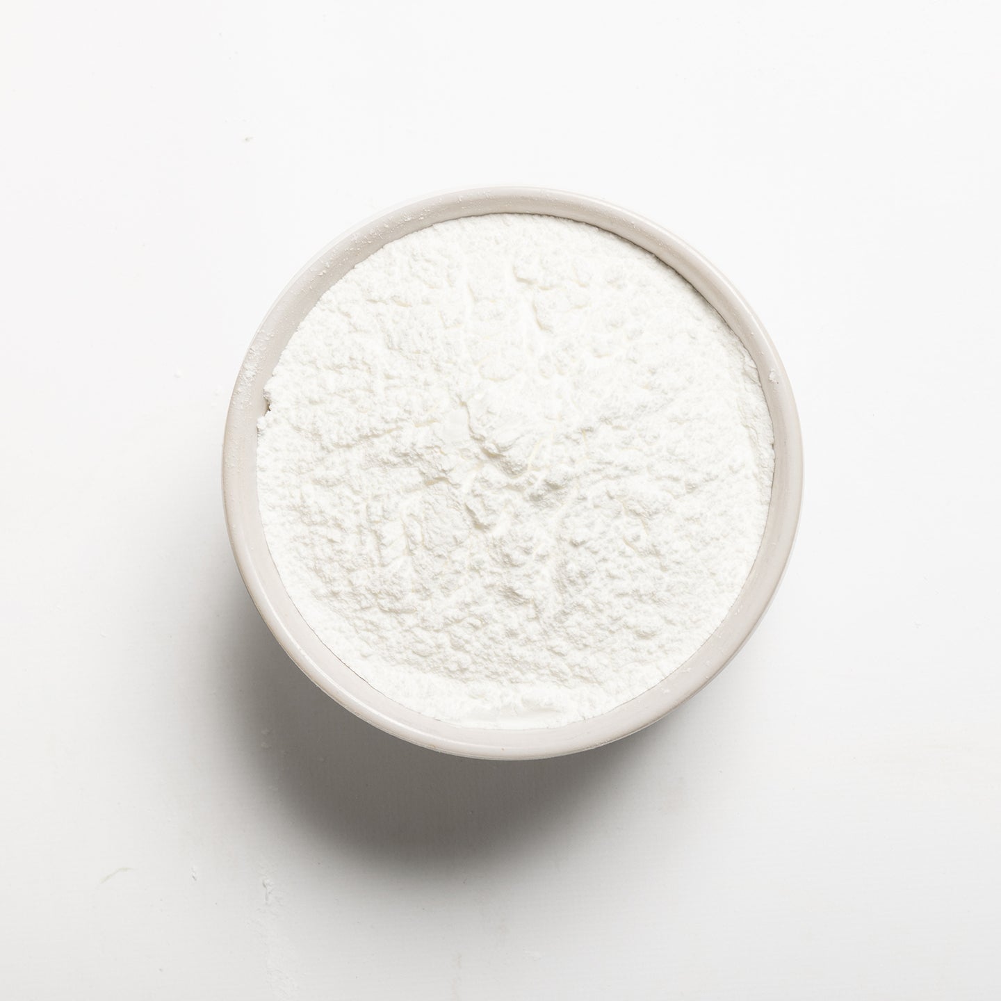 A bowl filled with non-GMO baking powder, made in the USA 