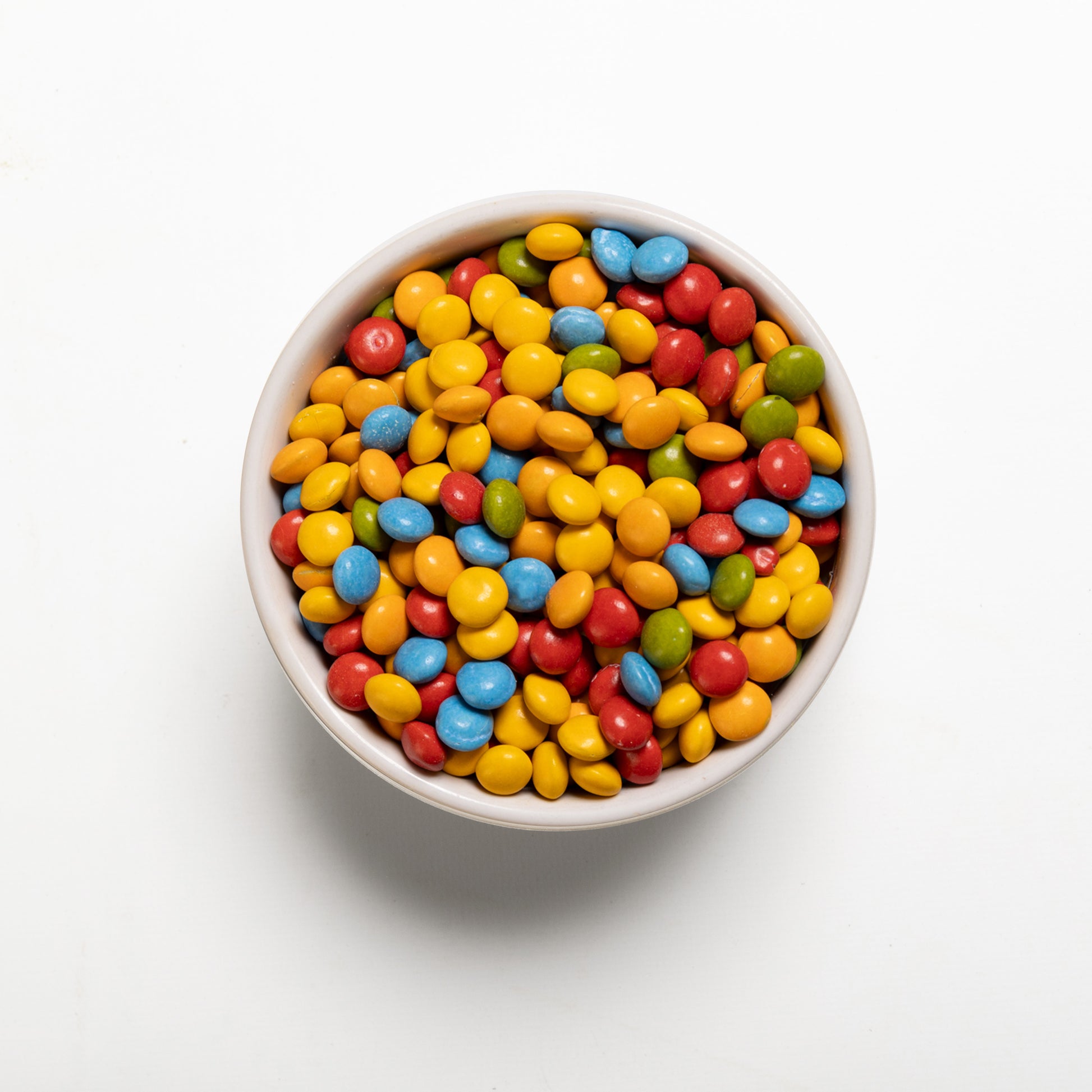 A bowl filled with multi-colorful semi-sweet candy buddies