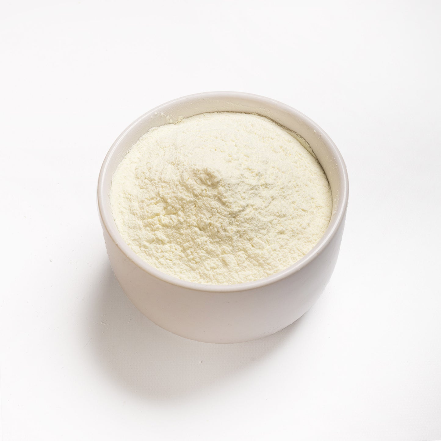 A bowl filled with Non-Fat Dry Milk Powder from RHBULK 