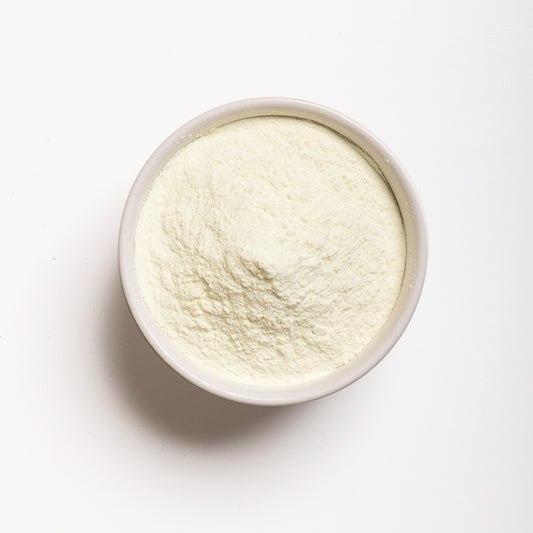 A top view of Non-Fat Dry Milk Powder in a bowl 