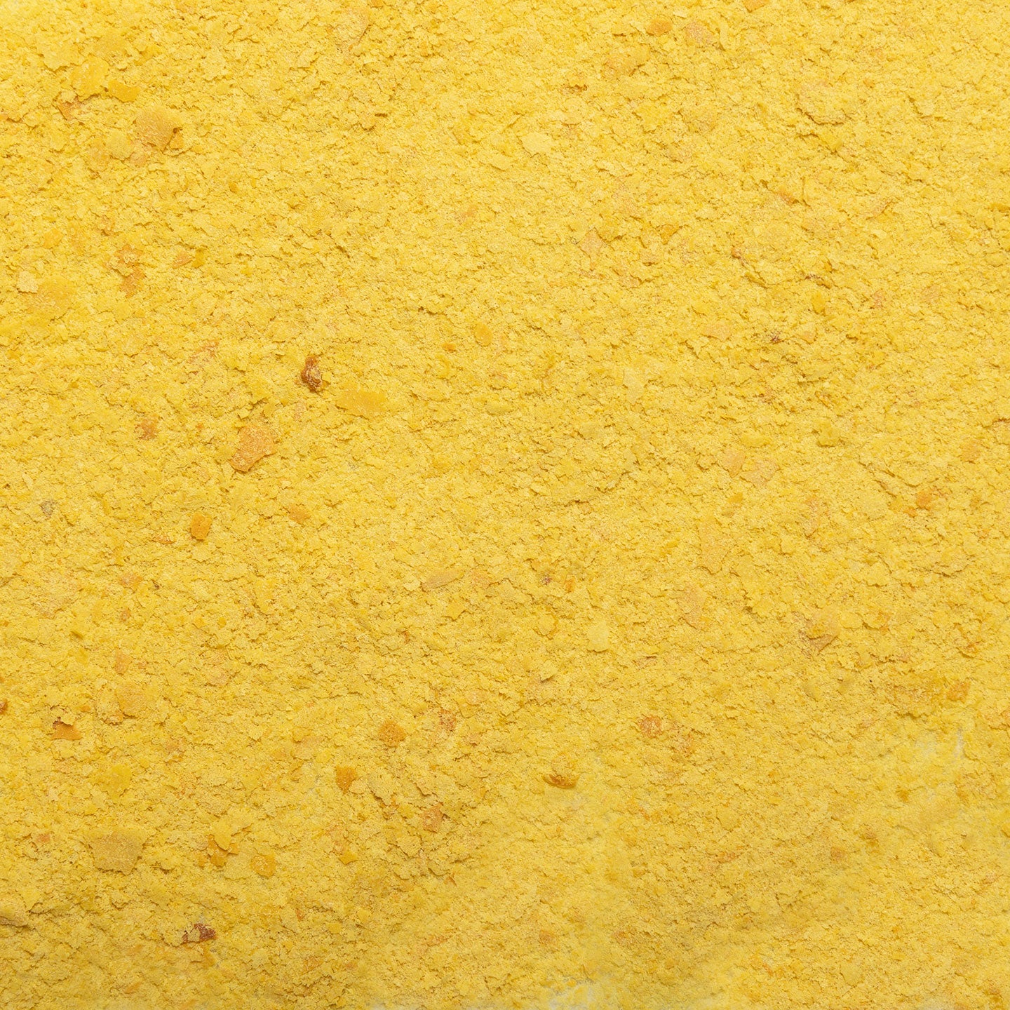 loose product photo of Nutritional Yeast showing texture of flakes 