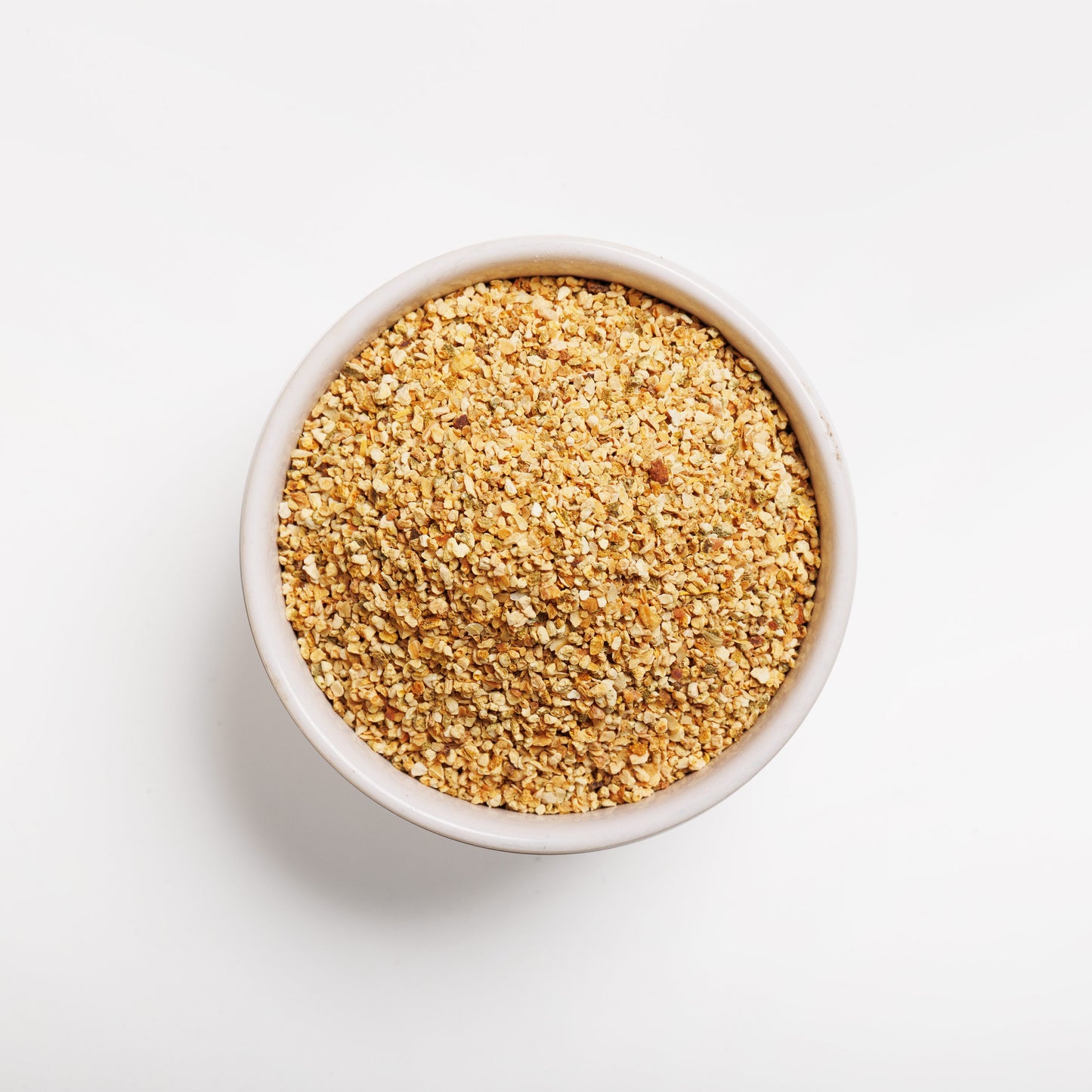 Top view of Orange Peel Granules in a white bowl 