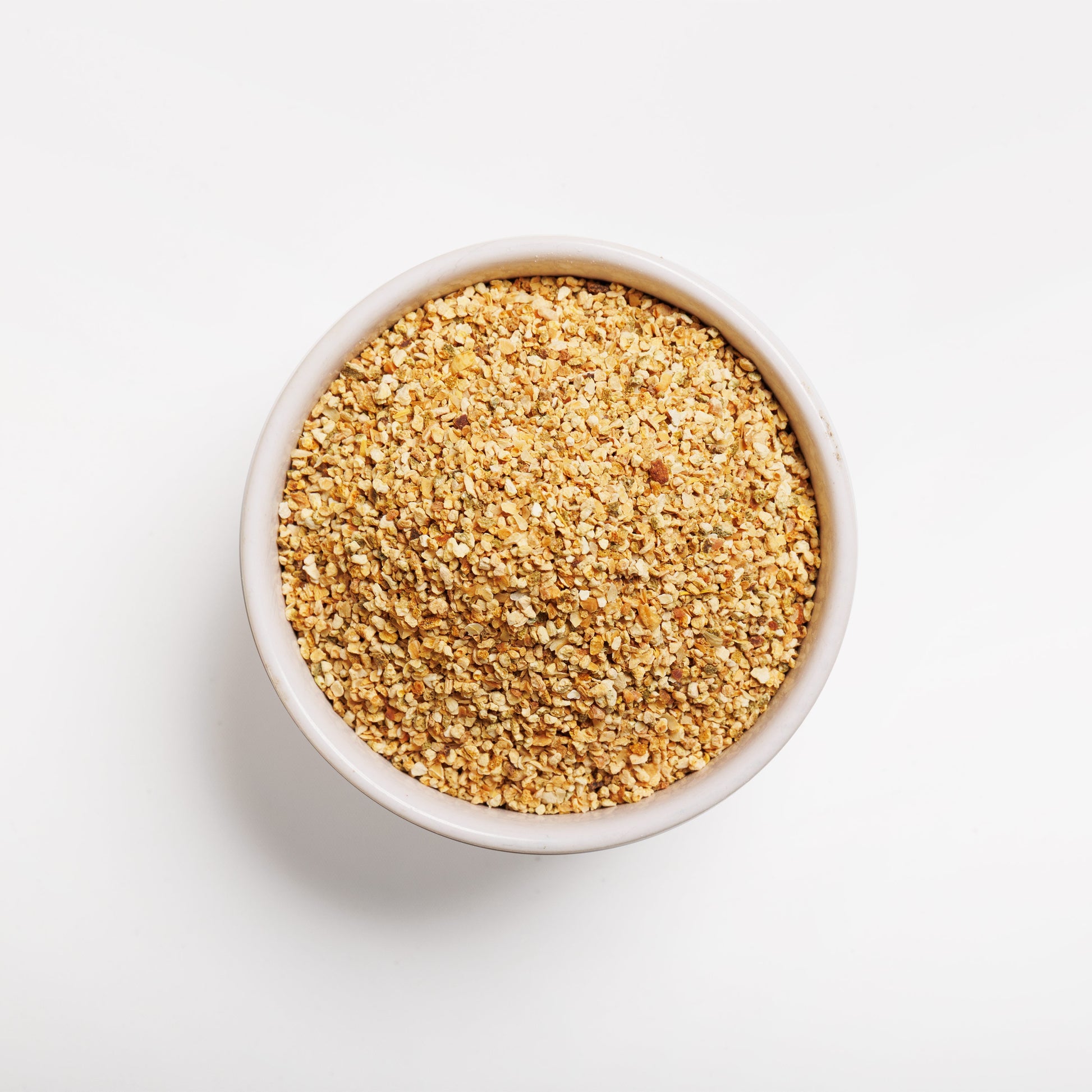 Top view of Orange Peel Granules in a white bowl 