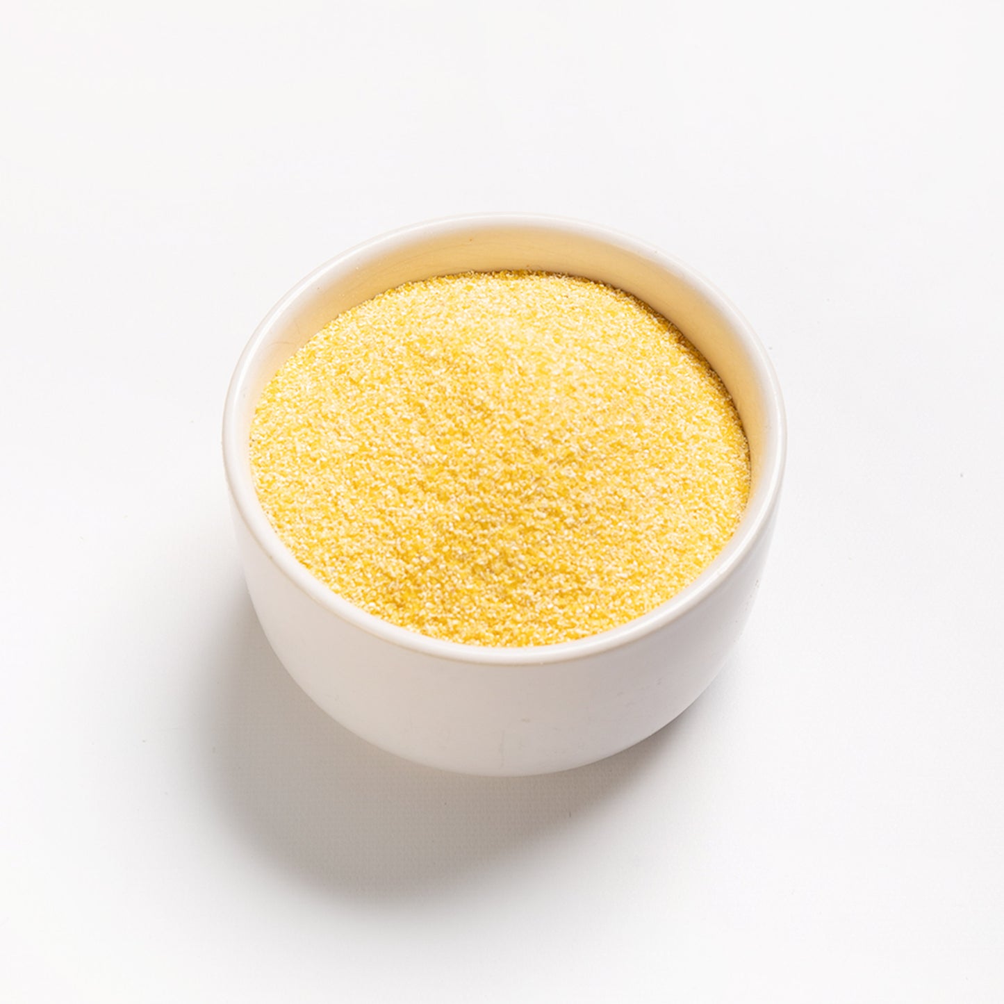 A bowl filled with Organic Medium Yellow Corn Meal from RHBULK 