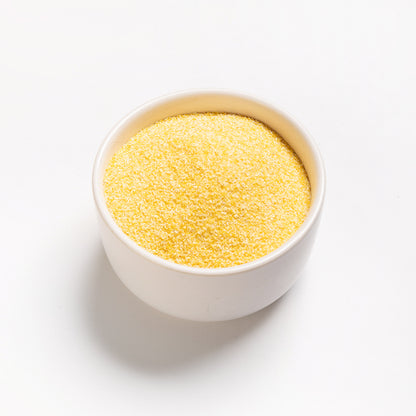 A bowl filled with Organic Medium Yellow Corn Meal from RHBULK 
