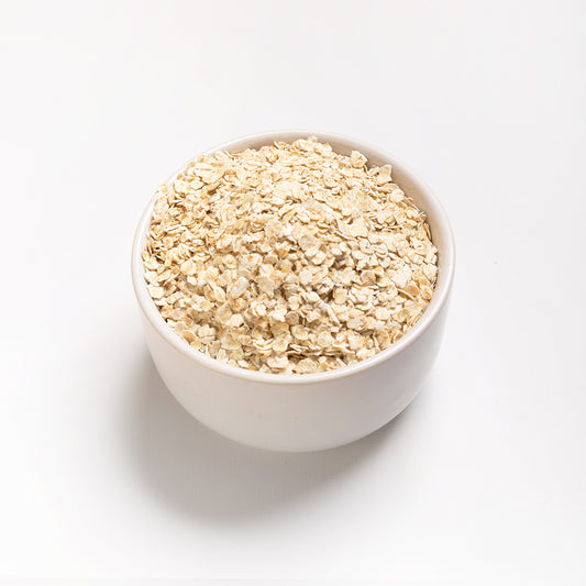 A bowl with Organic Rolled Oats on a white background.