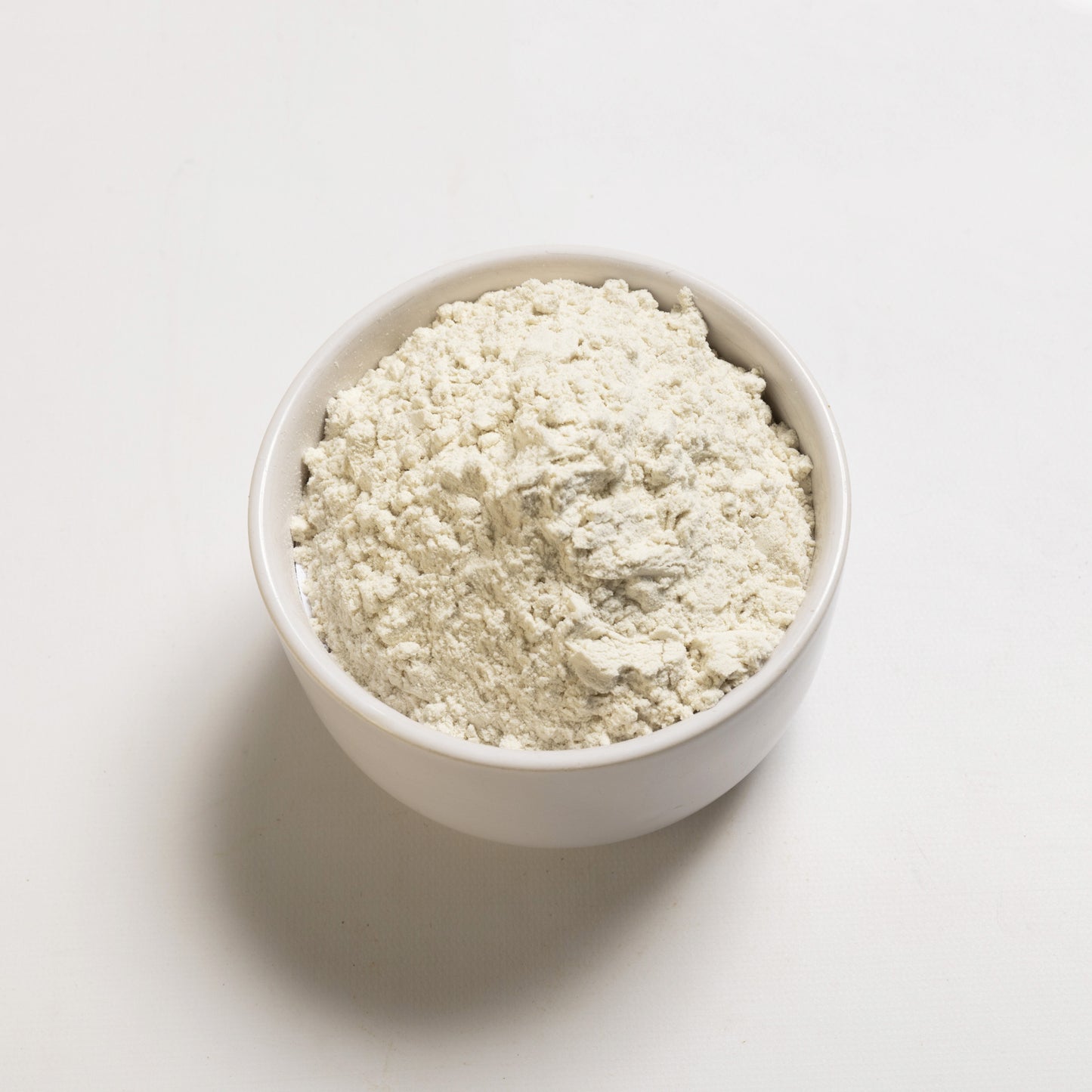 A bowl of white, powdery organic gum blend, likely made from guar gum and locust bean gum, intended for culinary use.