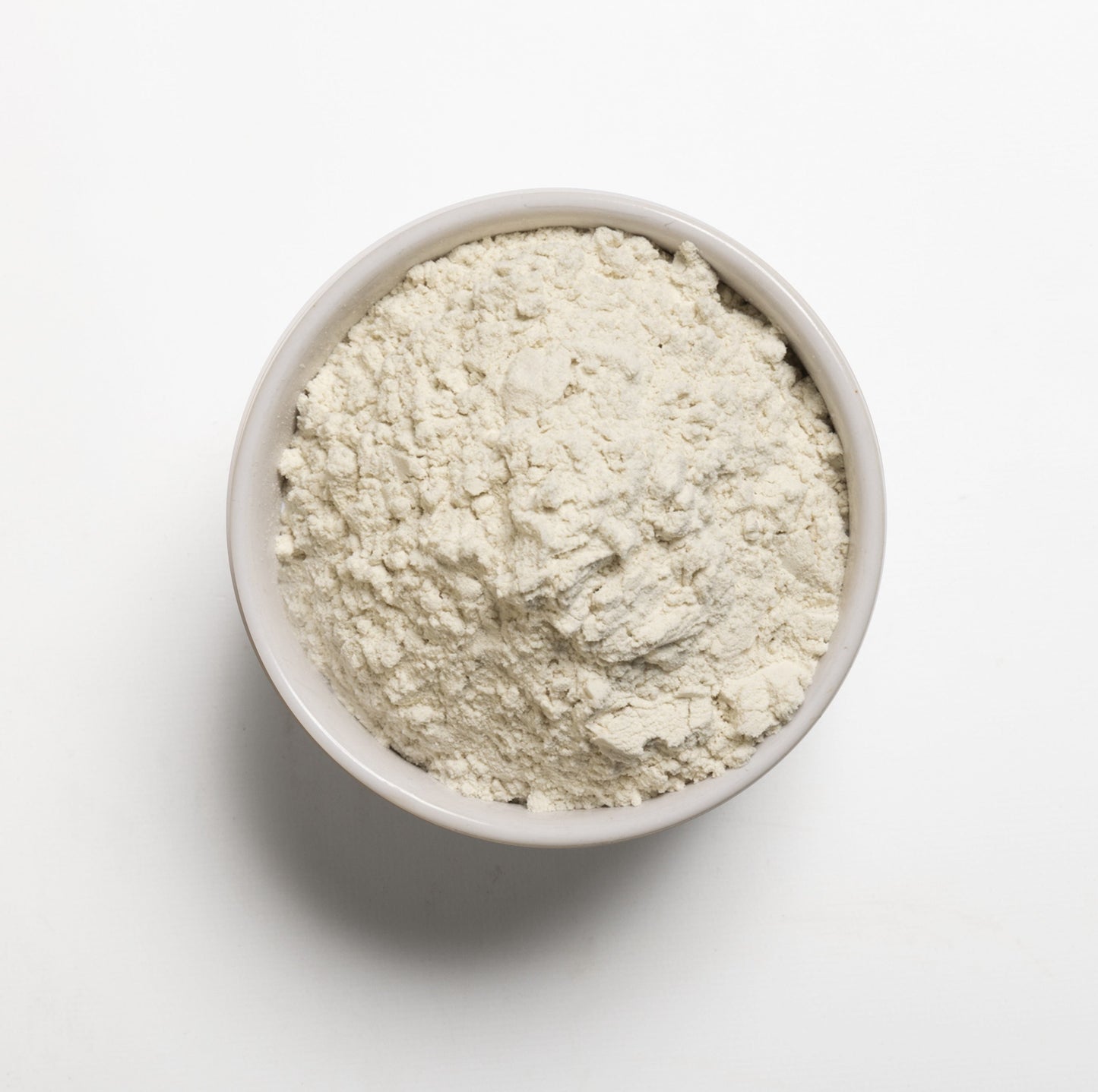 A bowl filled with Organic Gum blend  on a white background