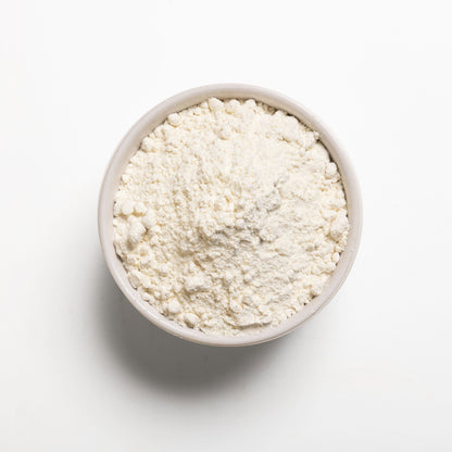 A bowl filled with Organic pastry flour on a white background