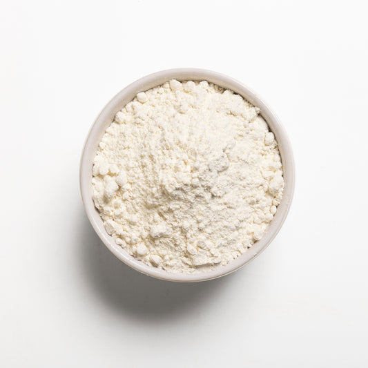 A bowl filled with Organic pastry flour on a white background