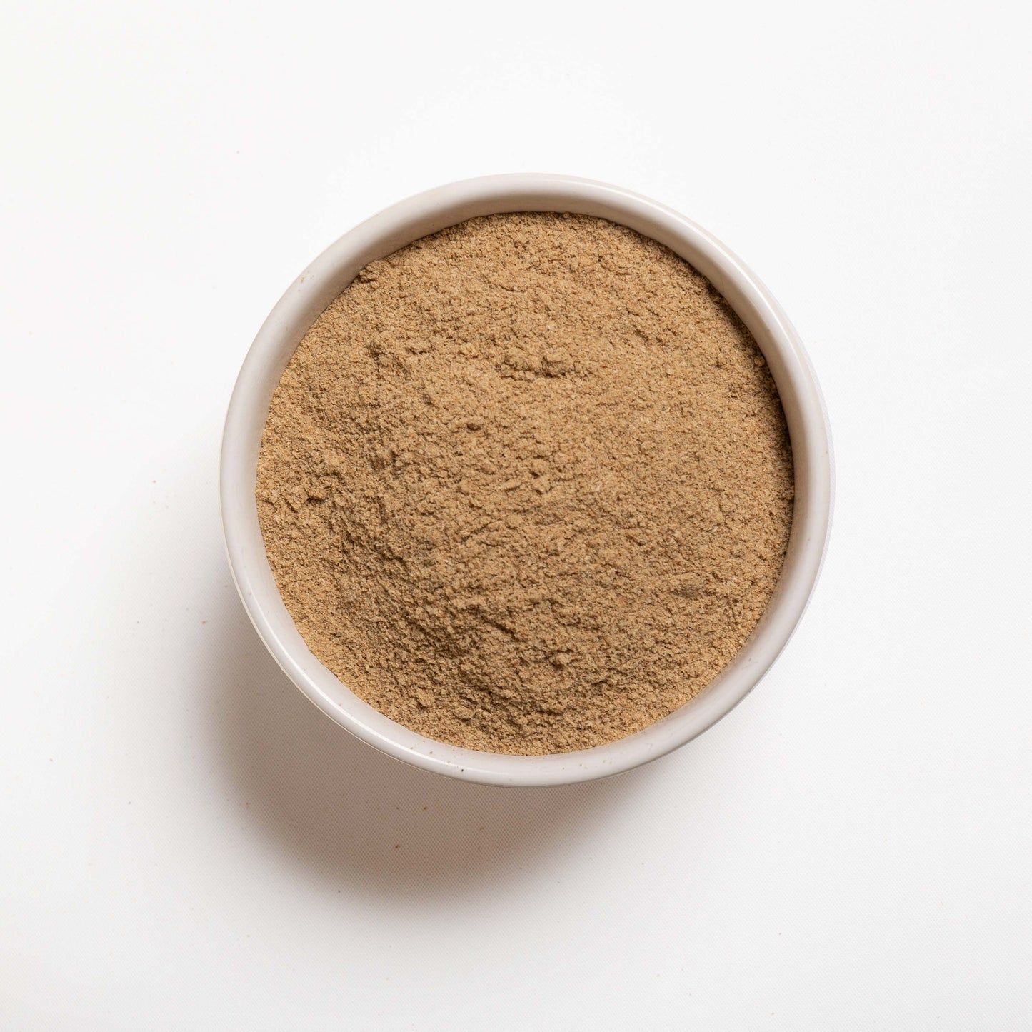 A white bowl filled with Psyllium Husk Powder from RHBULK 