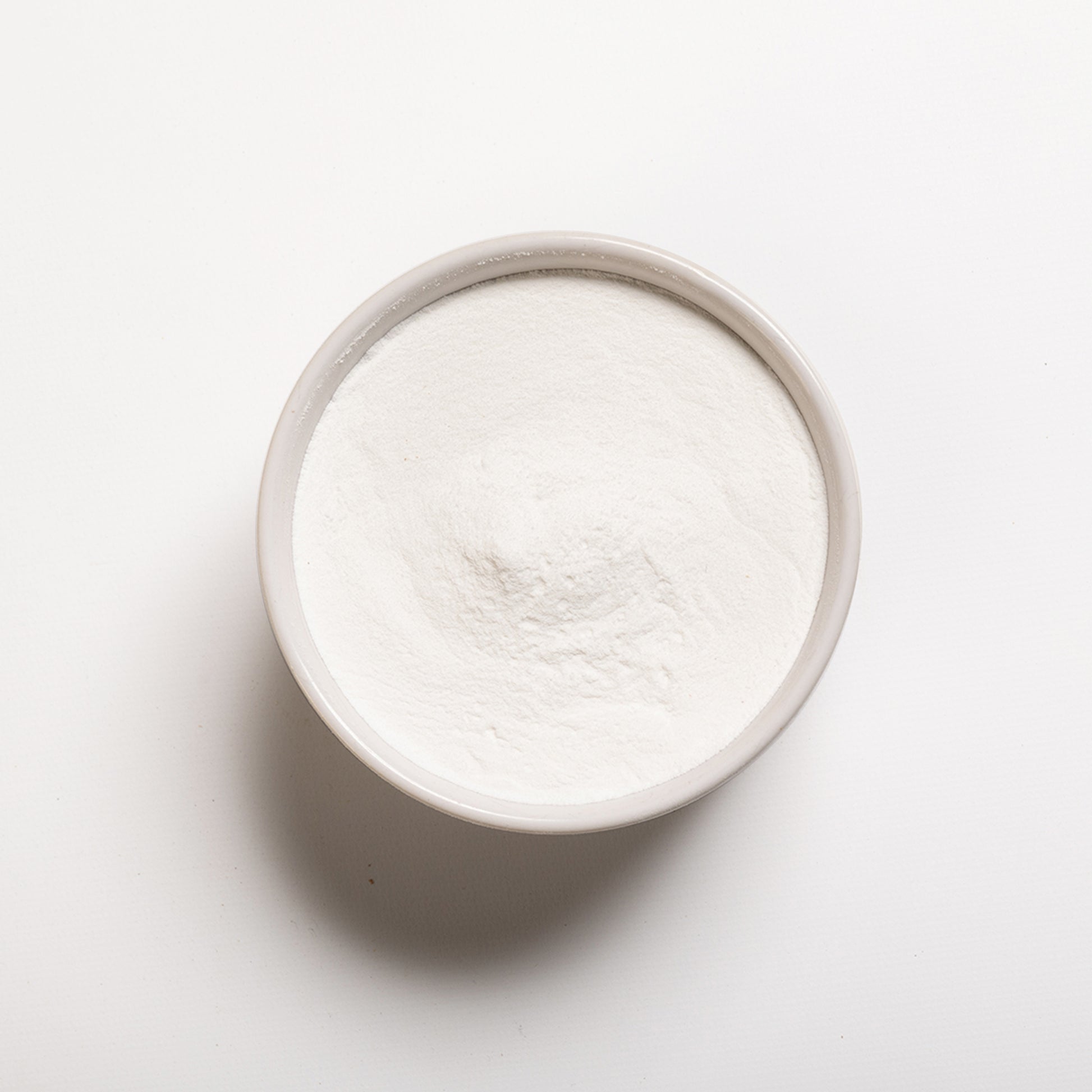 A white bowl filled with Stevia powder from RHBULK  