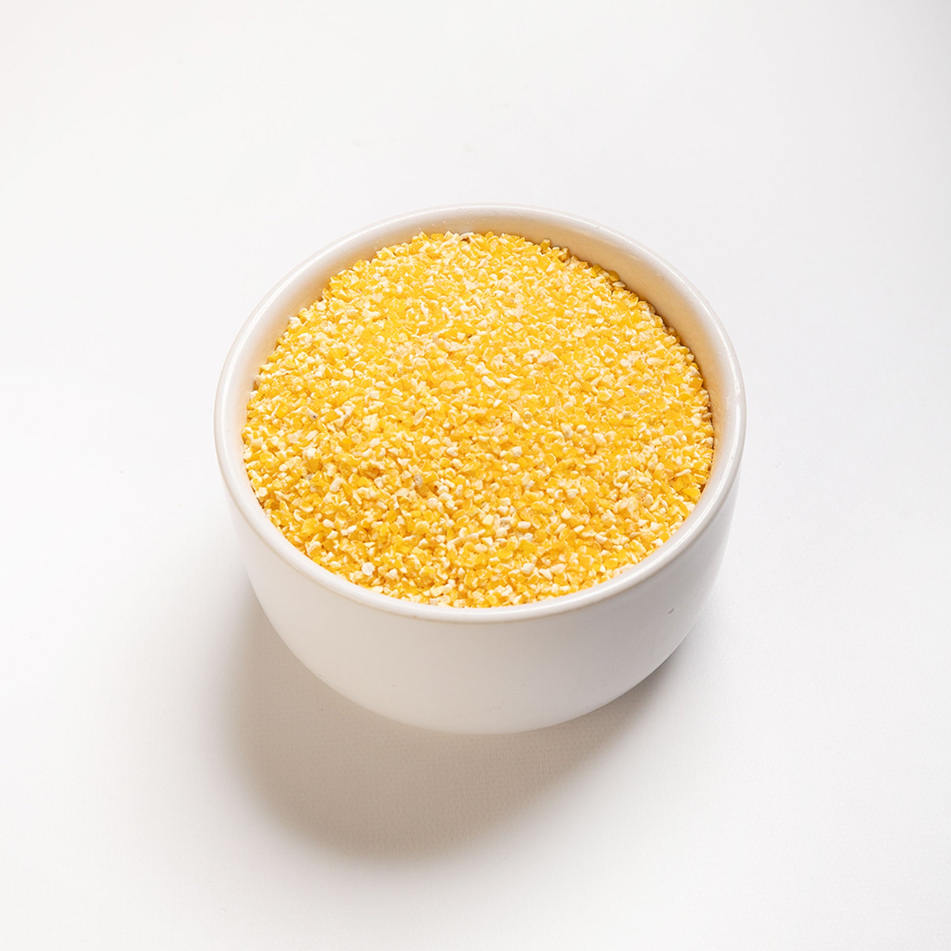 A bowl filled with #16 yellow course grits from RHBULK 