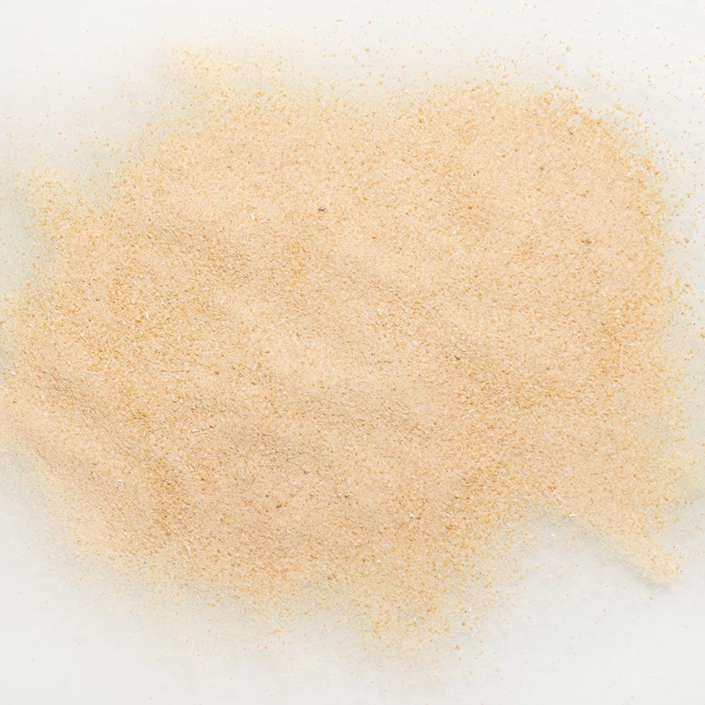 Close-up of maple flavor powder on a white background