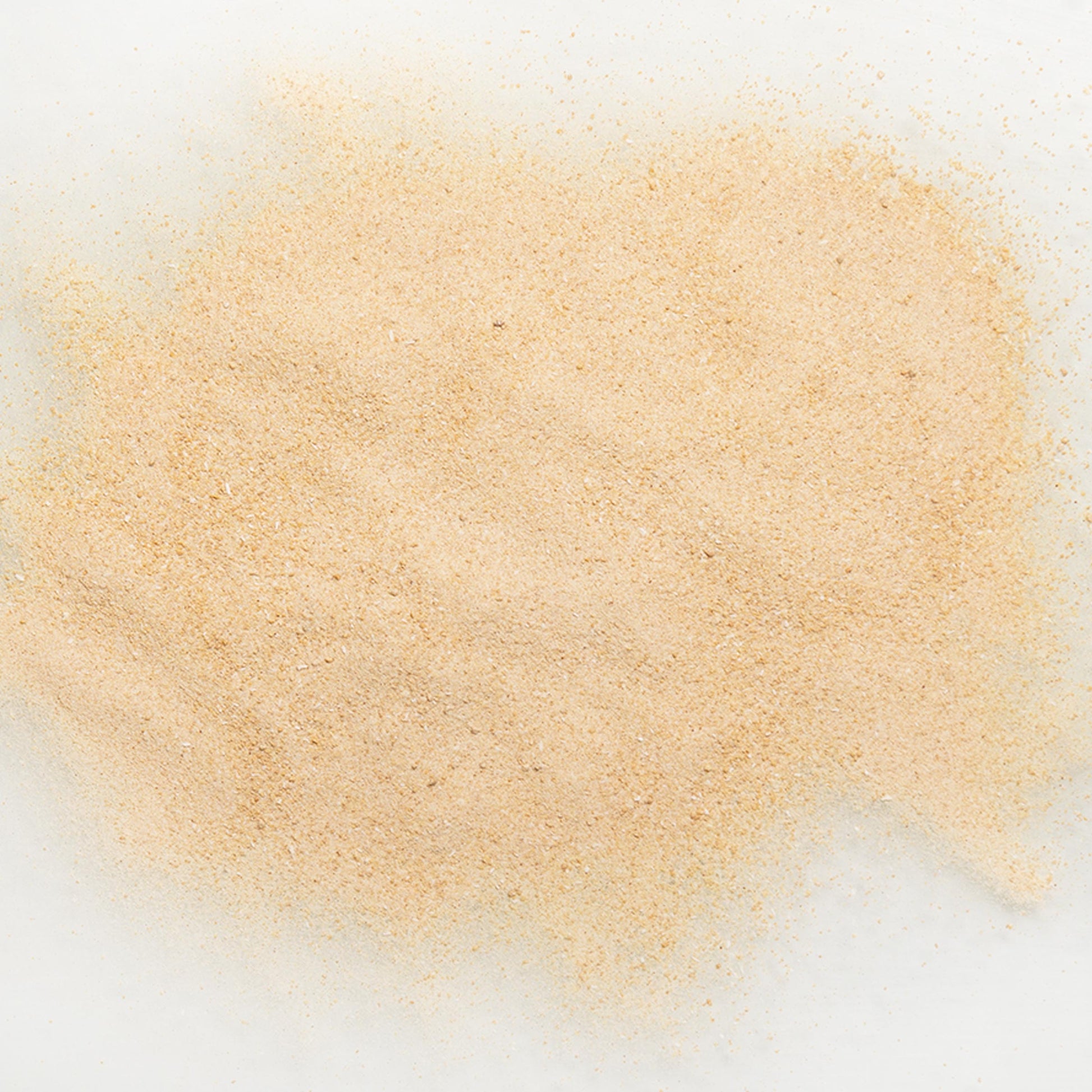 Close-up of maple flavor powder on a white background